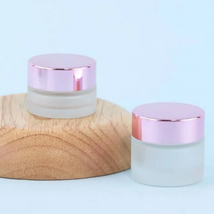 Tarros de vidrio con tapa rosa
